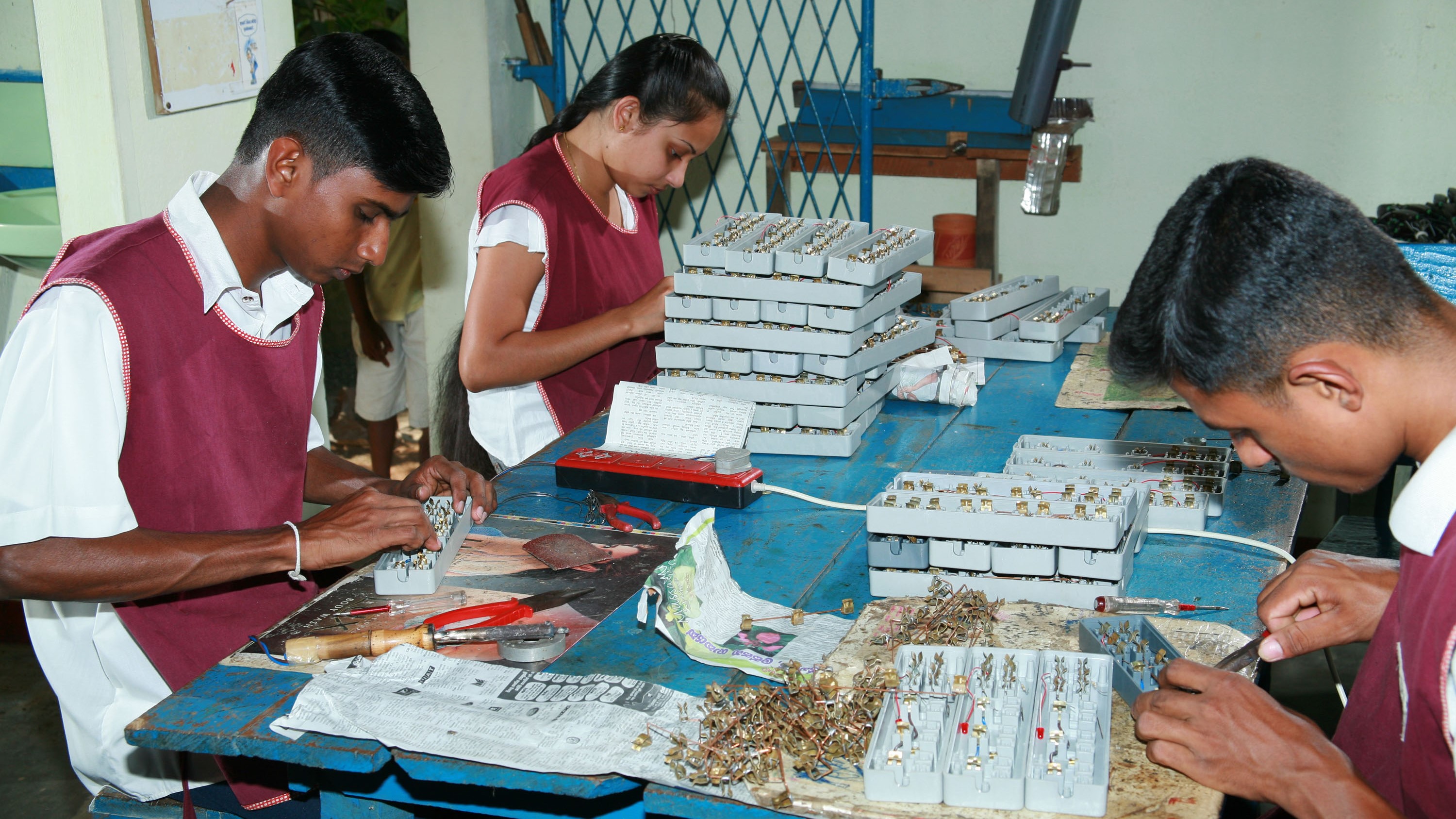 Assembling different parts for multi socket extension codes Sri Lanka ILO